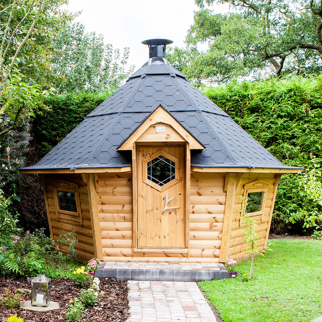 10m Arctic BBQ Cabin with black roof in garden