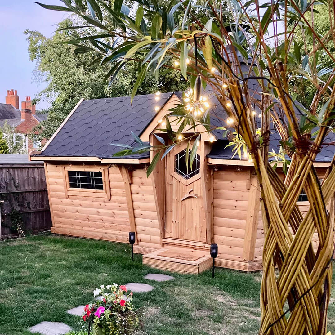 Arctic Cabins BBQ hut at dusk with sparkly fairy lights to decorate