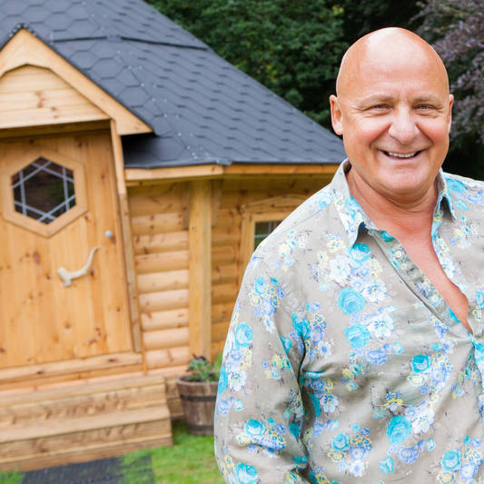 Aldo Zilli in front of his BBQ cabin hut