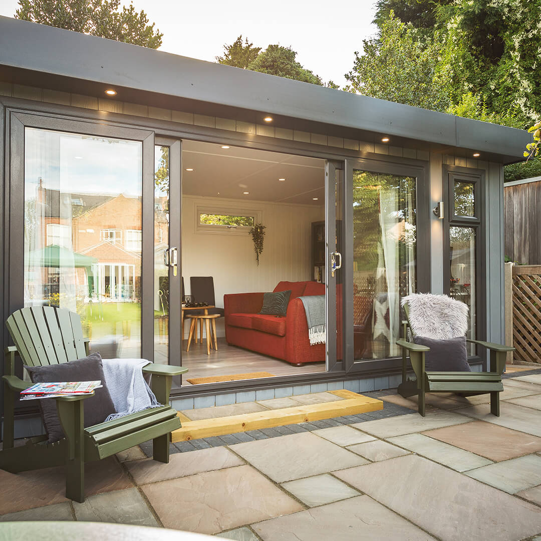 a marley garden bar room with a patio and chairs and a couch in it