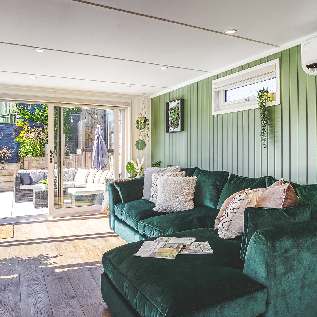 Looking from the outside of a garden room pod on a sunny day