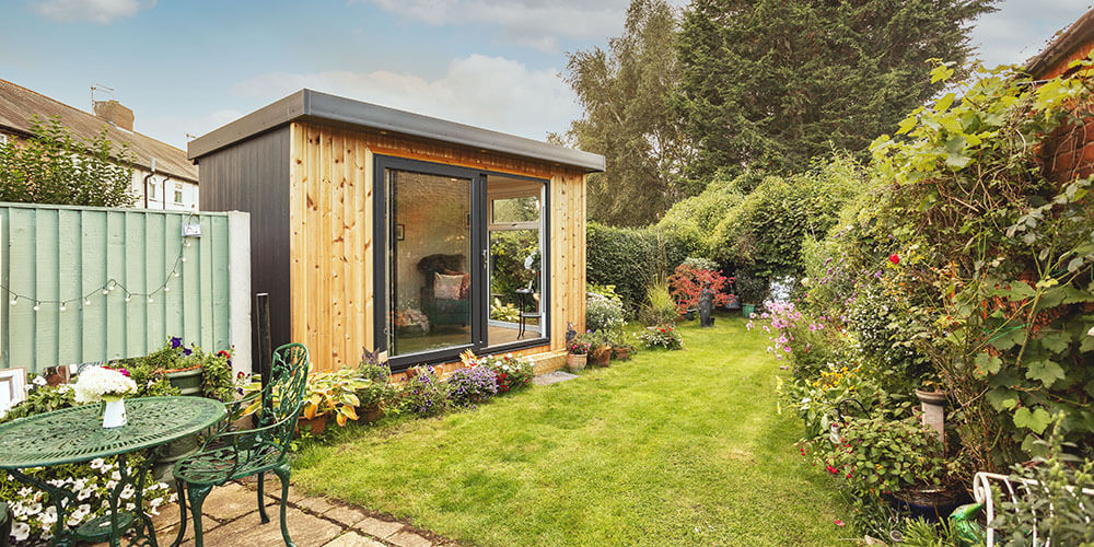 Small hybrid garden room in sweet, rustic garden