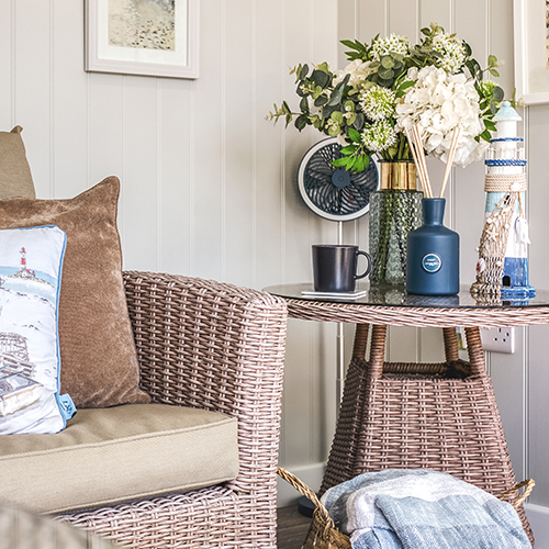 Table styling detail inside a seaside themed summerhouse