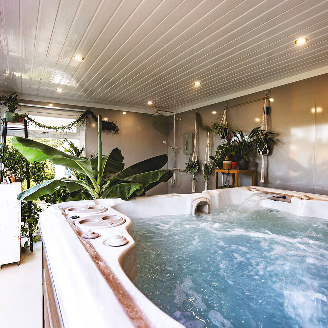 Cabin Master Hydropool Midlands Hot Tub Room internal view with large indoor plants and shower and spotlights in the ceiling