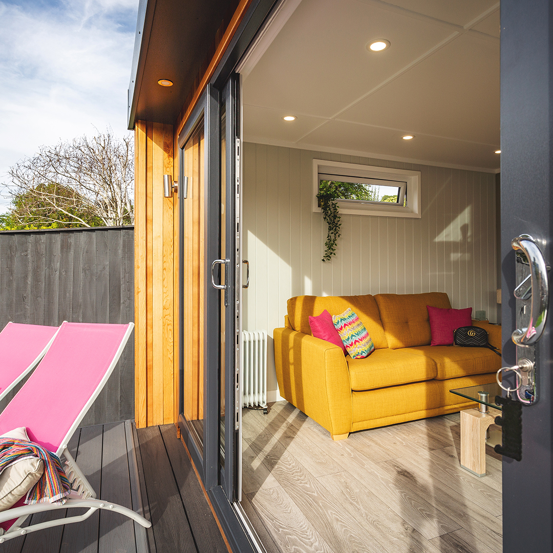 Cabin Master Summerhouse Inside View with yellow sofa