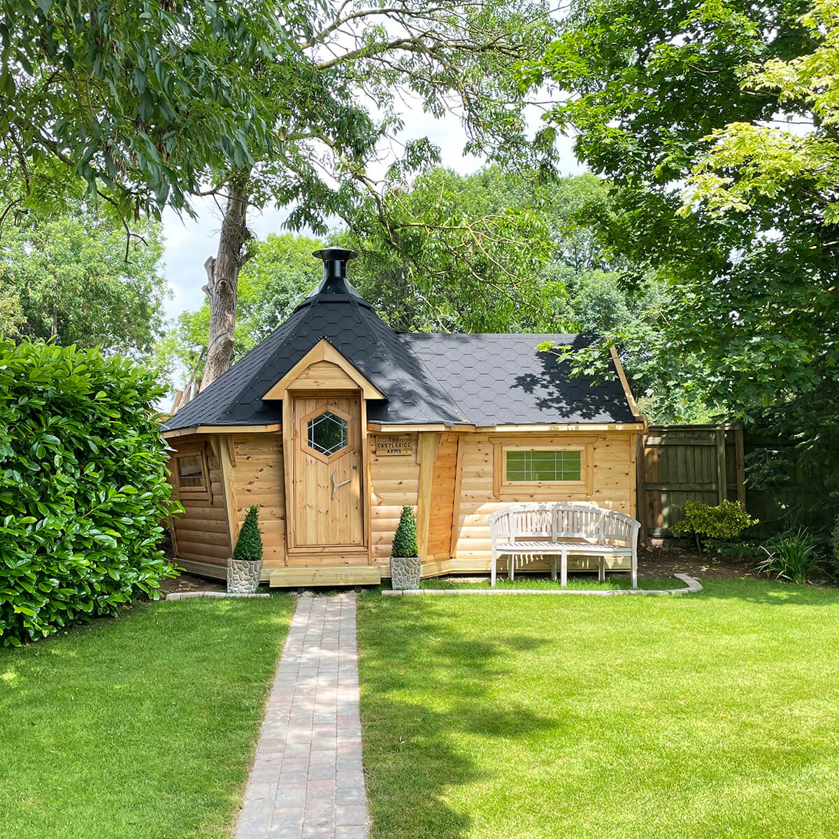 BBQ garden bar with bench outside and path leading down