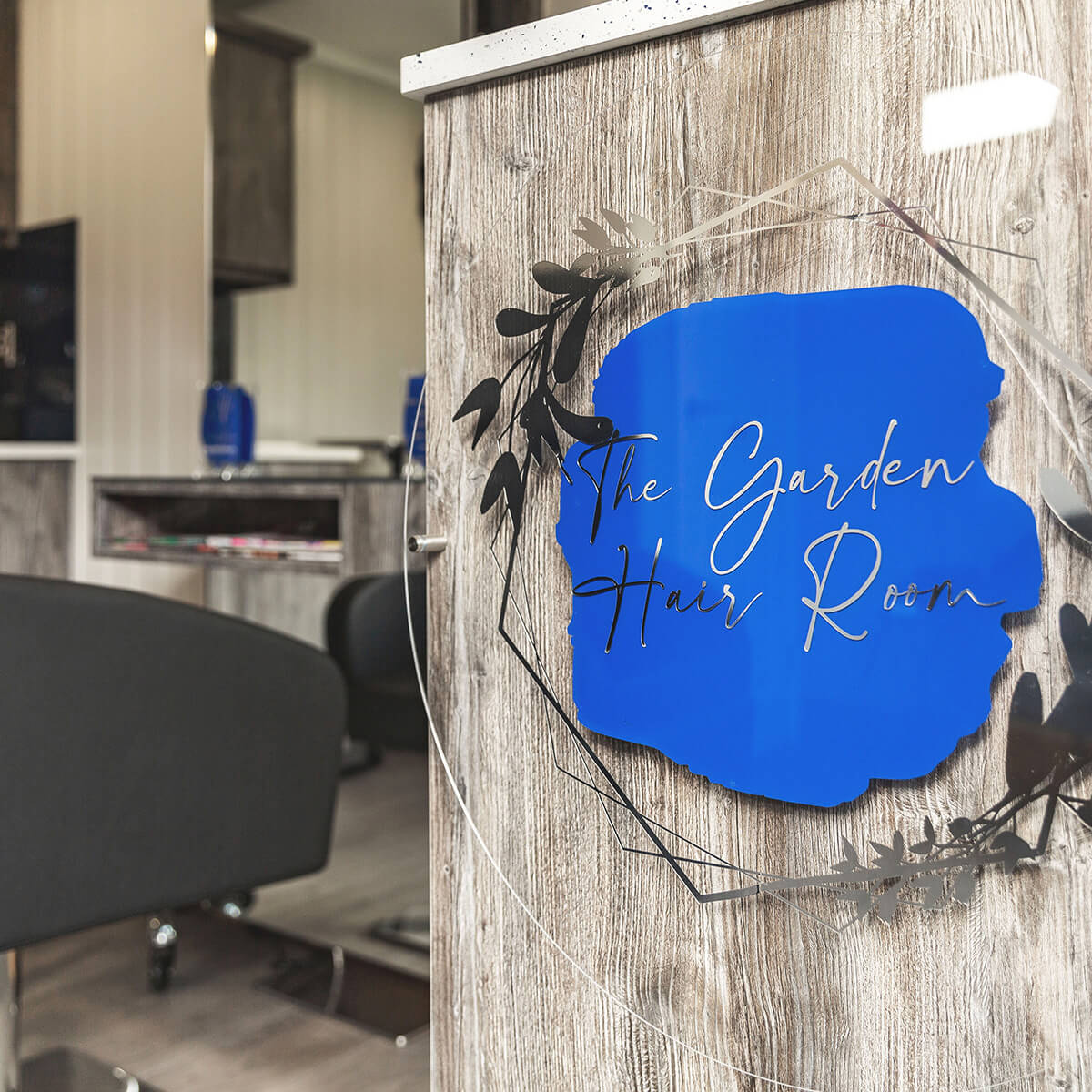 home business garden room with blue plaque and business name on it 
