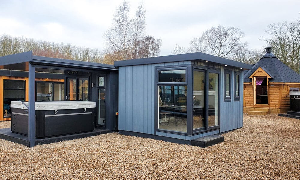 Garden room and hot tub underneath shelter at the Studley show site