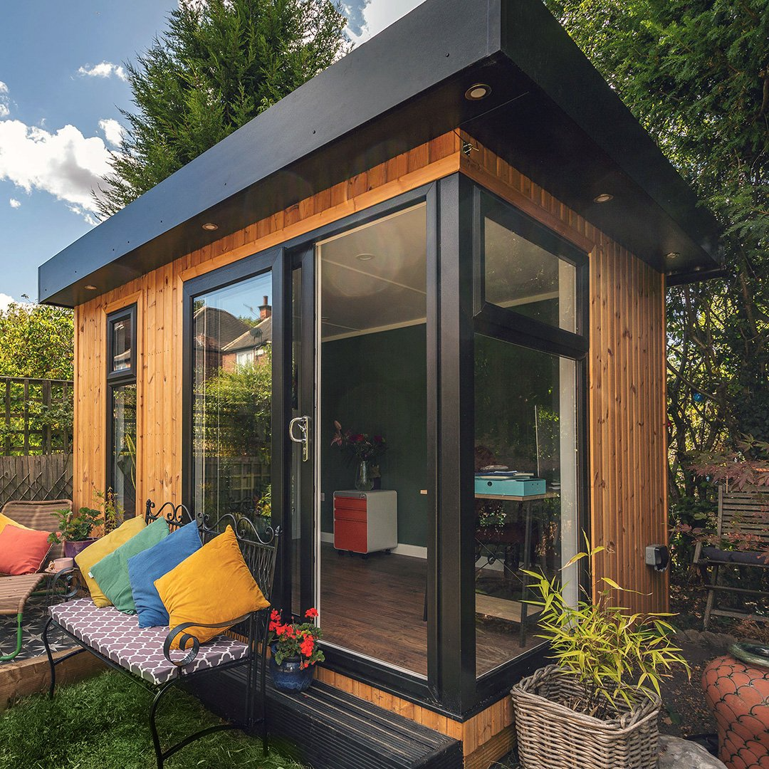 Cedar Garden Office with bench in front of glass sliding doors with colourful cushions