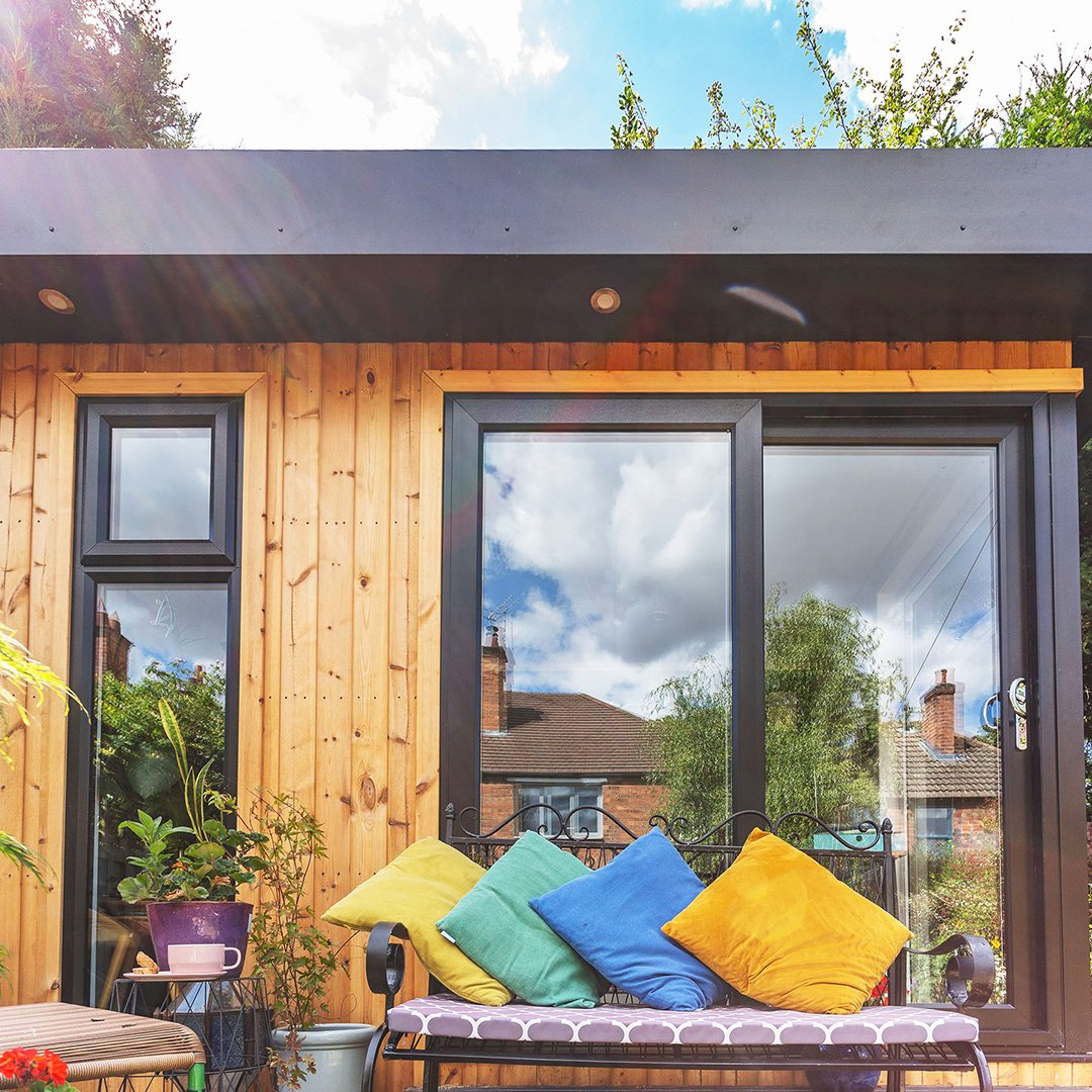 Cabin Master Cedar Office with bench outside and colourful cushions