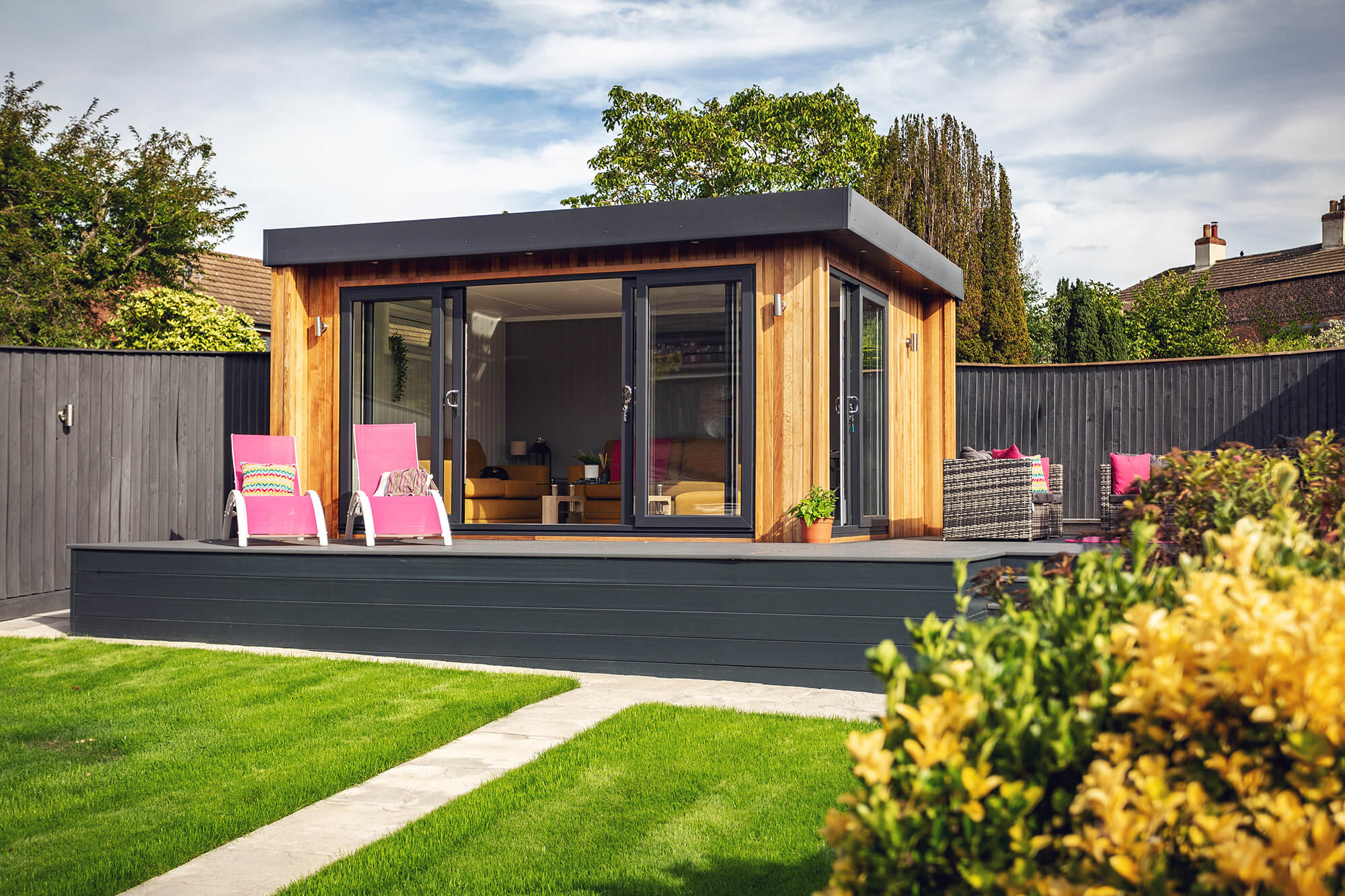 Cedar garden summer house on raised decking area