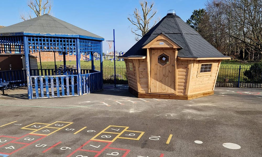 Scandinavian style school cabin on playground