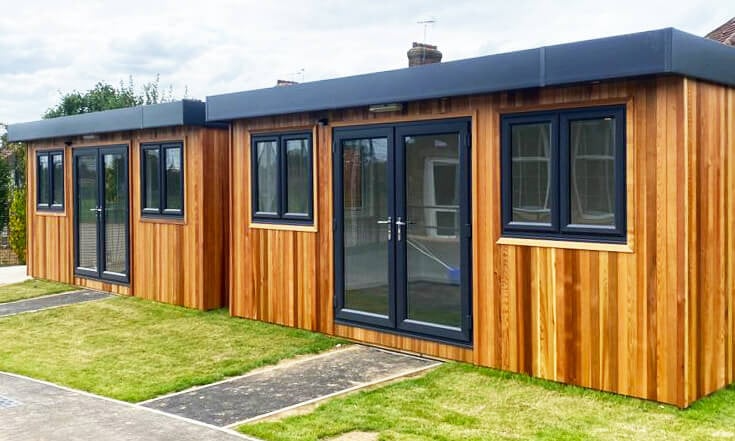 Two cedar clad school buildings