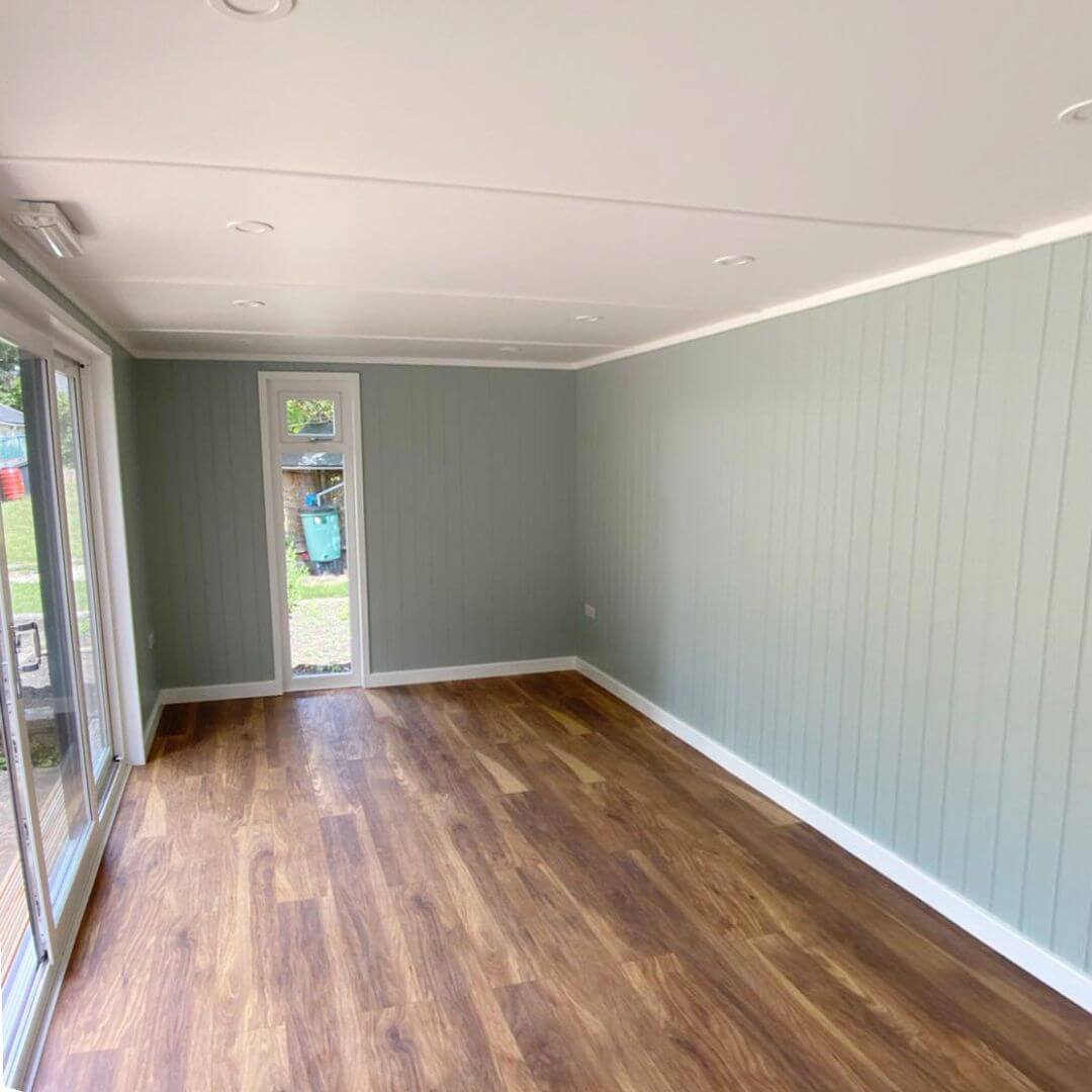 Cabins For Schools Edward Jenner School Redwood building with laminate flooring and sage green interior walls 