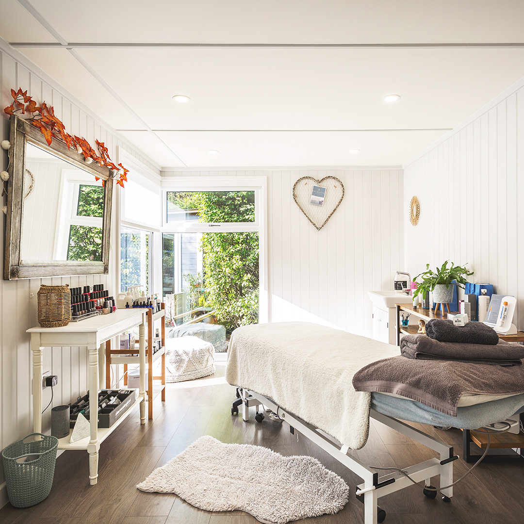 Interior of a garden beauty room with treatment couch
