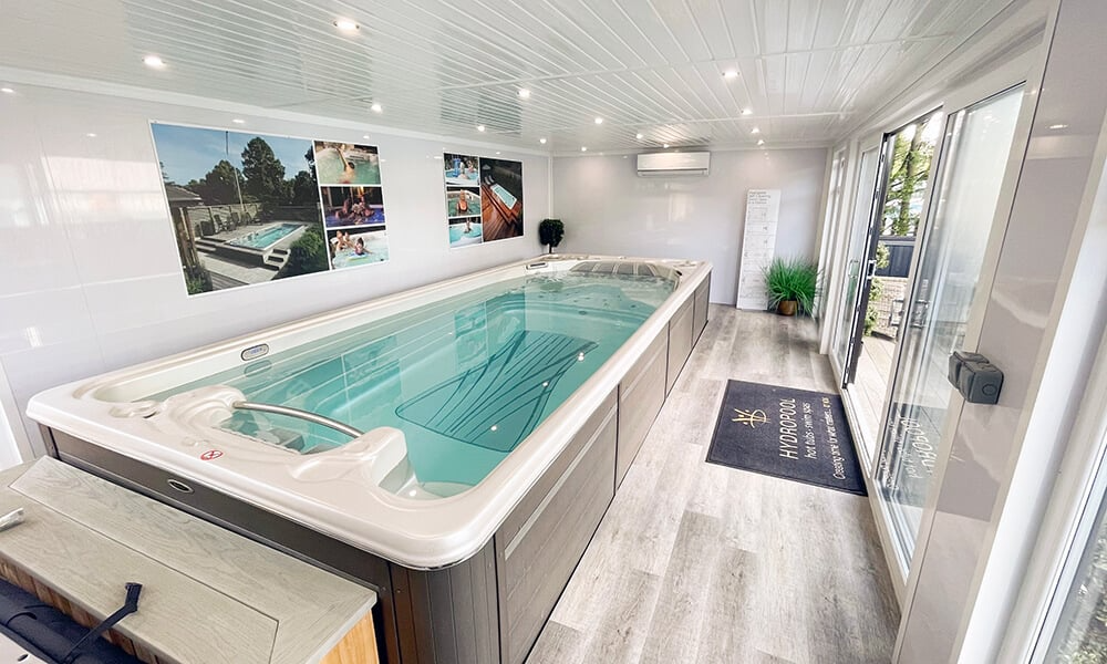 Interior of a garden room with spim spa inside at the Nottingham Cabin Master show site