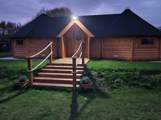 Happy Homestead Eco Nursery Forest School Outdoor Wooden Cabin at night