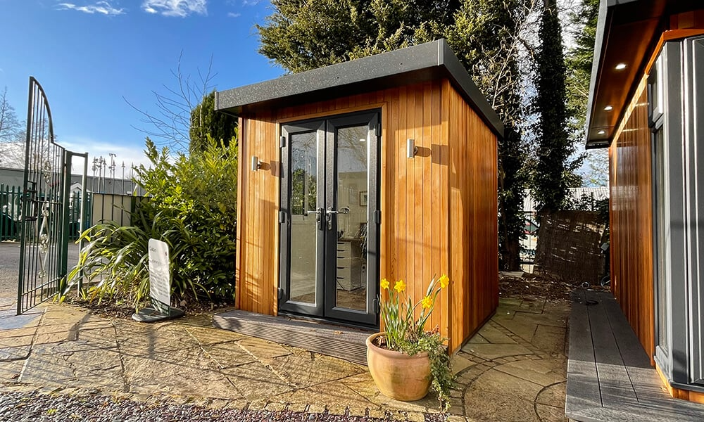Small garden office by Cabin Master at the Nottingham show site on a sunny day