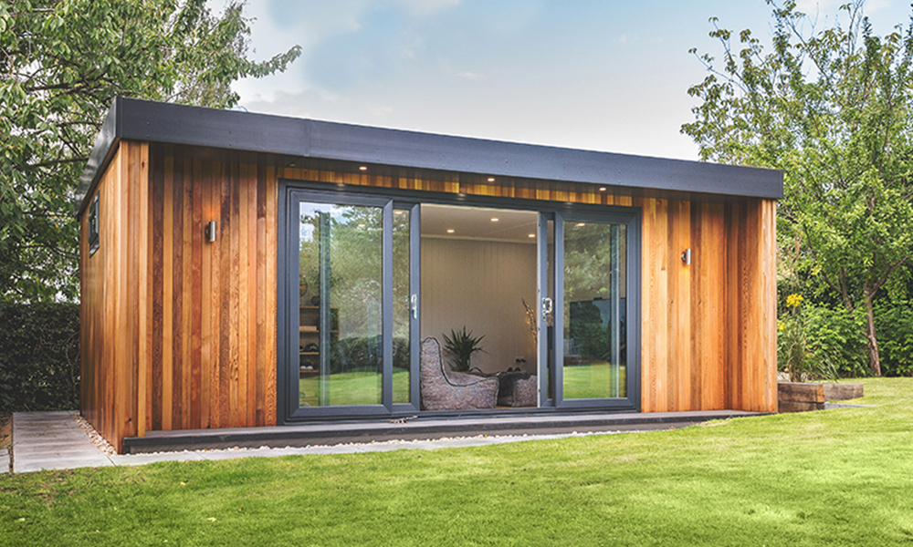 External shot of a luxury bespoke cedar clad garden room gym