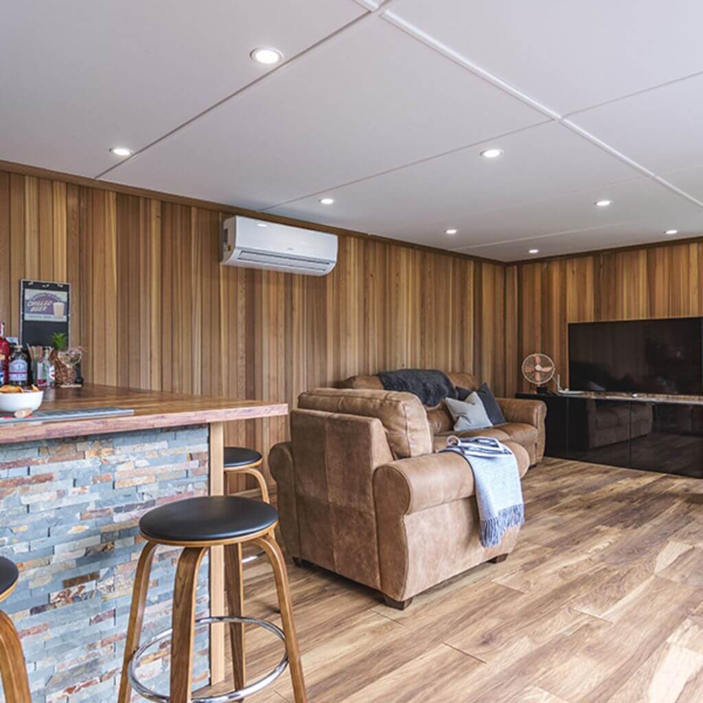 a garden bar living room filled with furniture and a flat screen tv