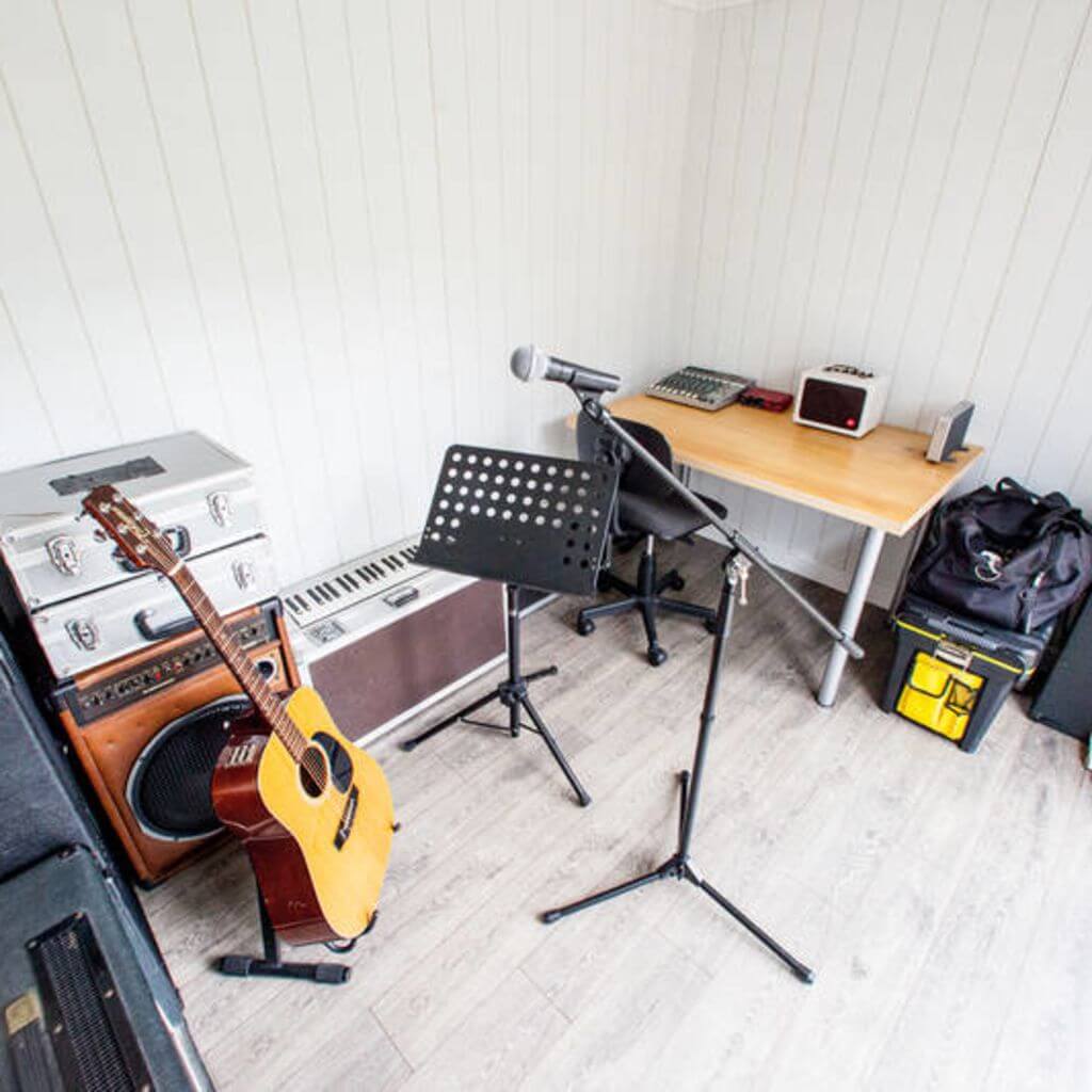 garden music room with guitar and microphone and sheet stand 