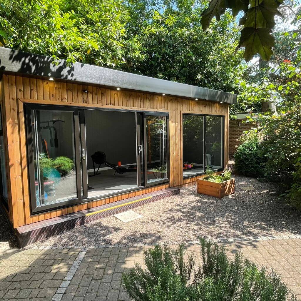Large Redwood Gym on Nottingham Show Site with planters and lavender alba plants with sliding glass doors open