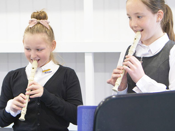 Langar C of E pupils practising music in their music cabin