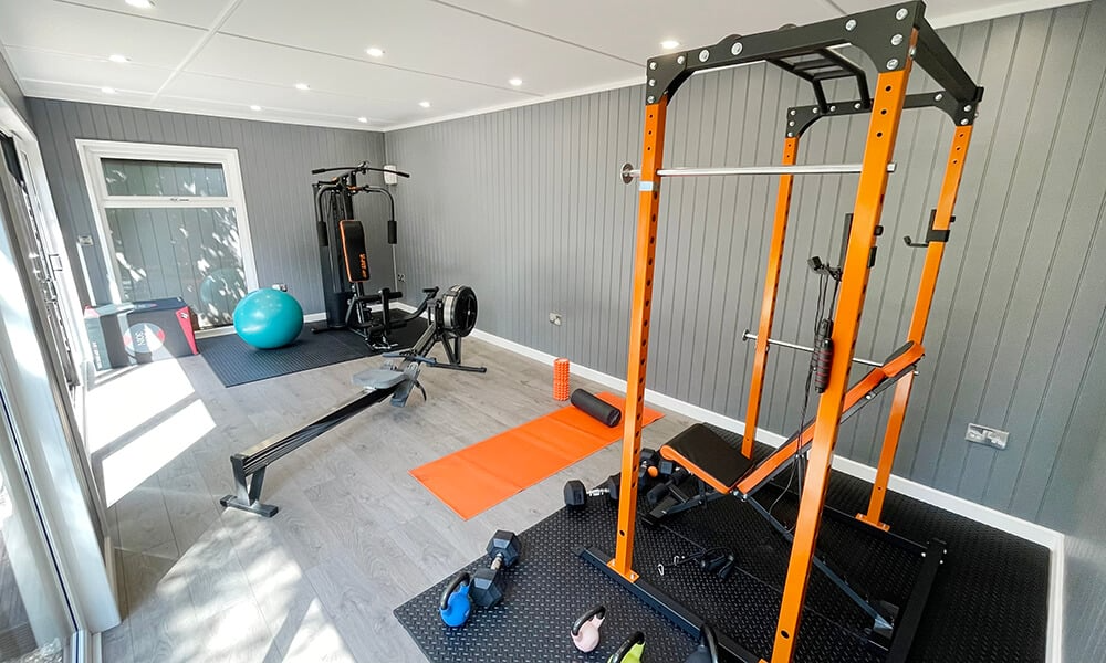 Interior of a garden room gym with gym equipment