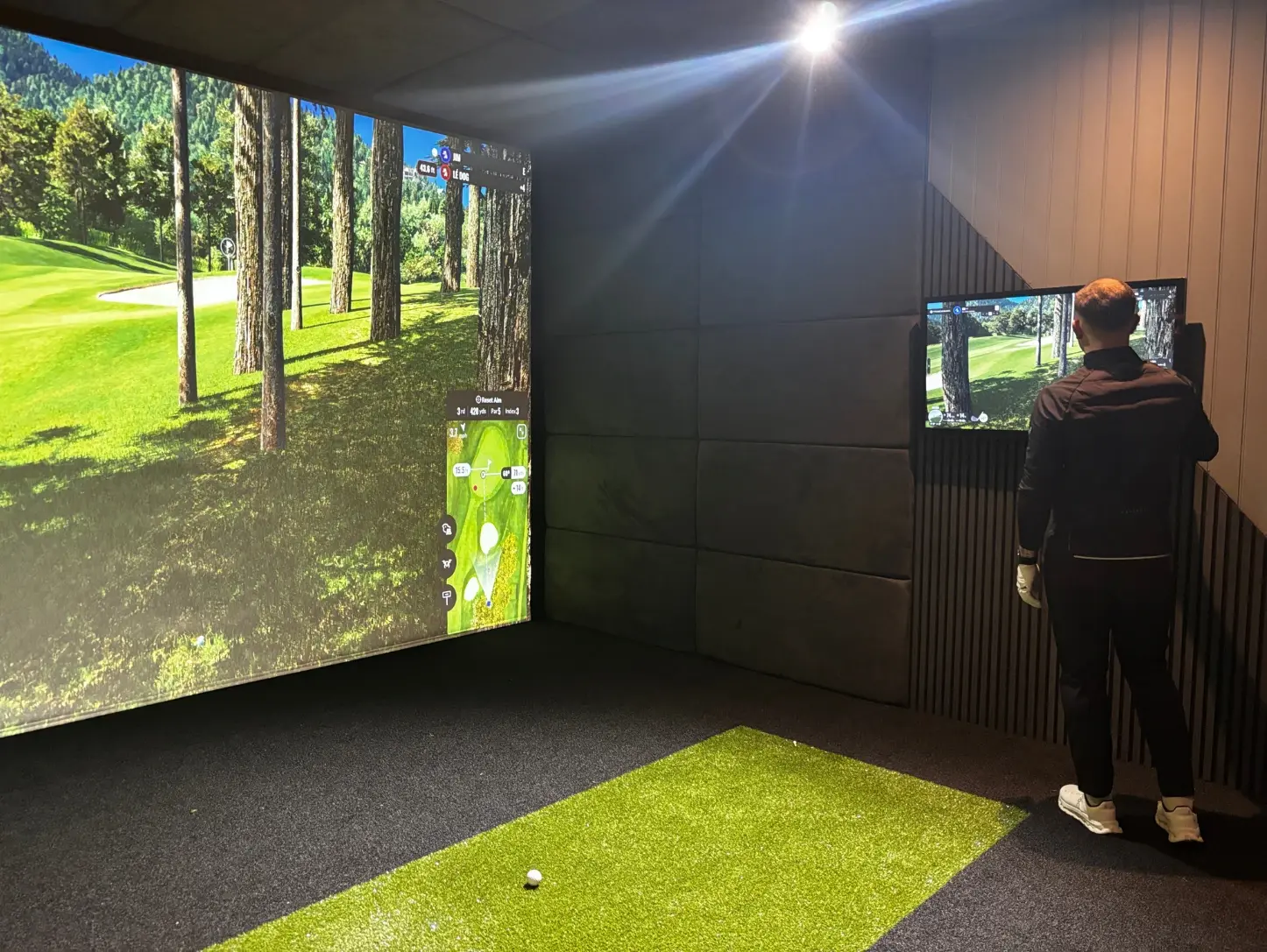 astro turf flooring inside a golf sim