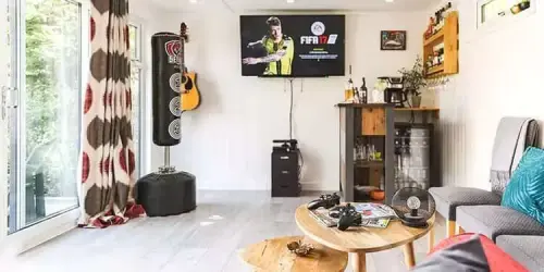 interior of a man cave with tv and playstation