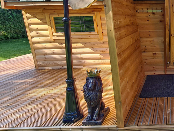 lion decoration in front of a bbq cabin