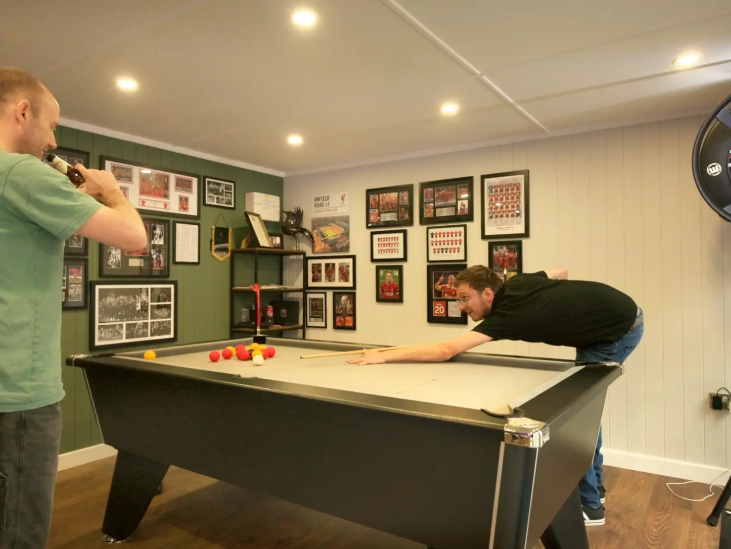 men playing pool in a mancave